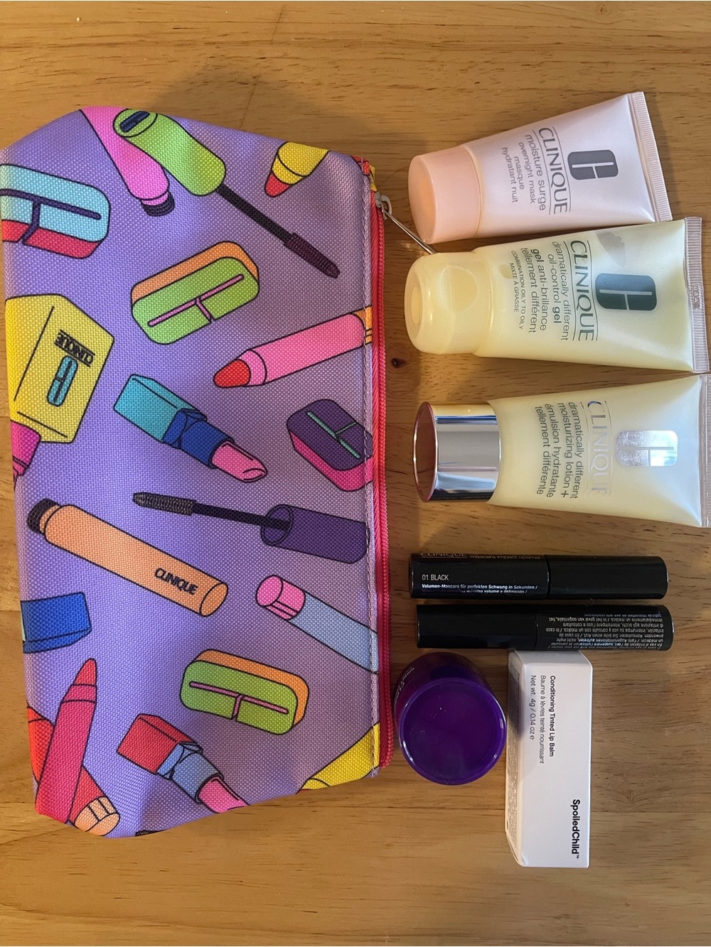 Clinique Skincare Set with Purple Cosmetic Pouch